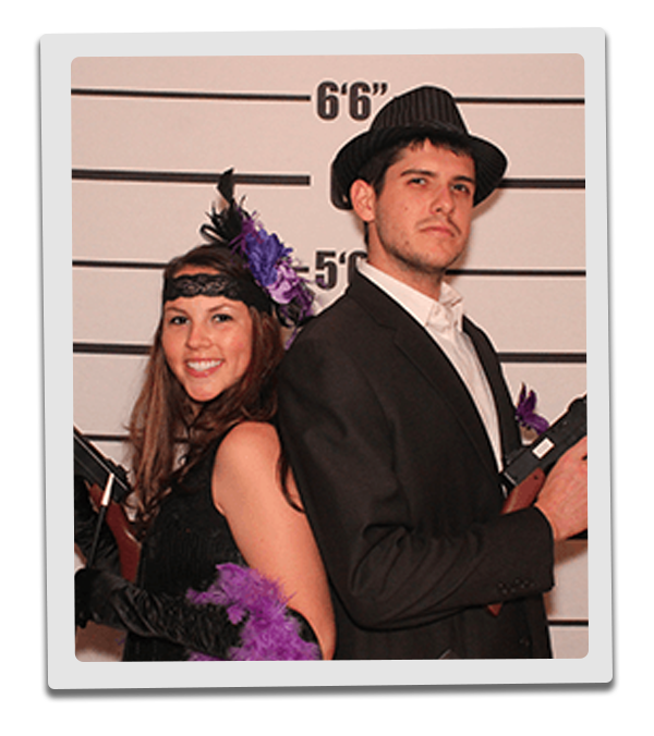 Denver Murder Mystery party guests pose for mugshots